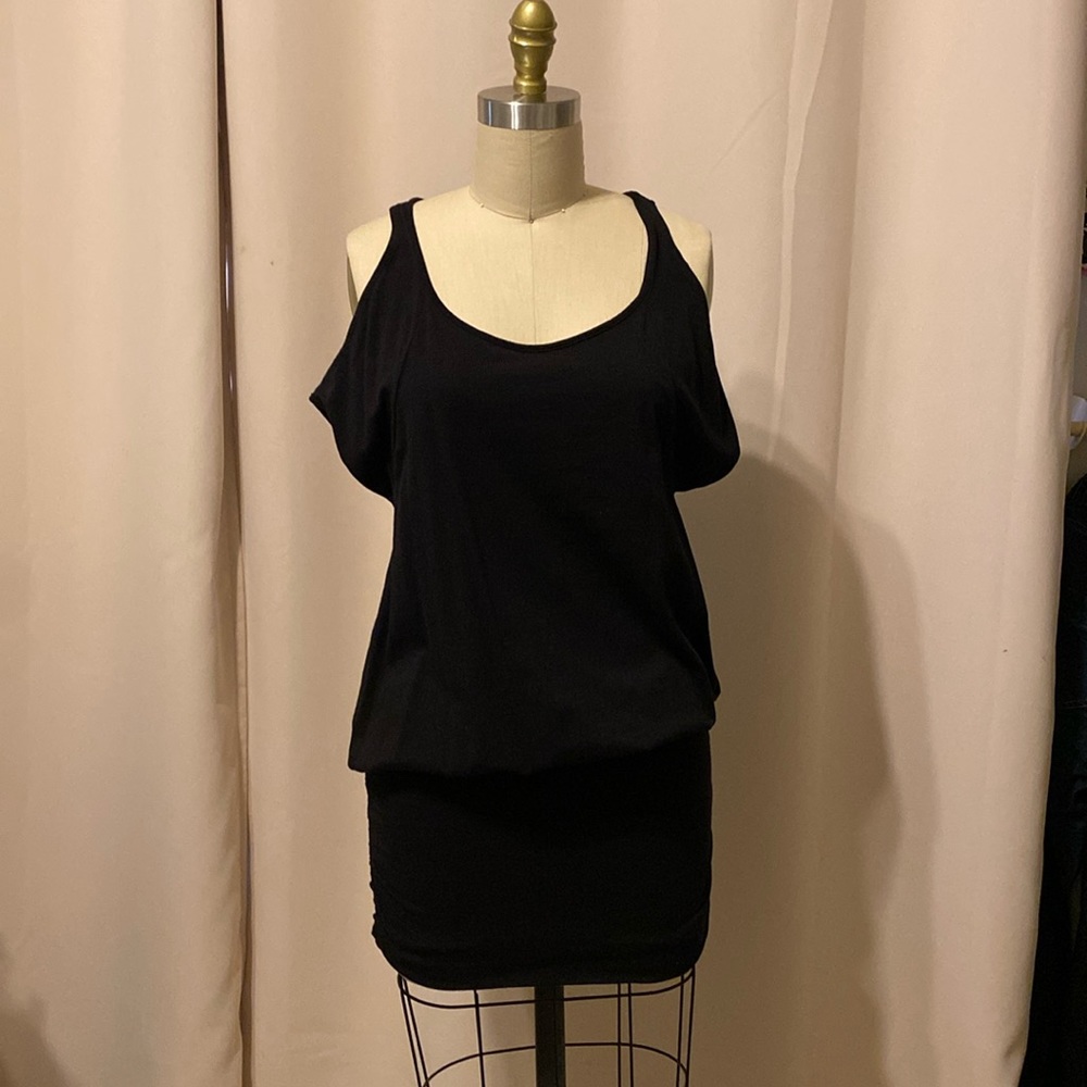 Little black dress with unique sleeve openings